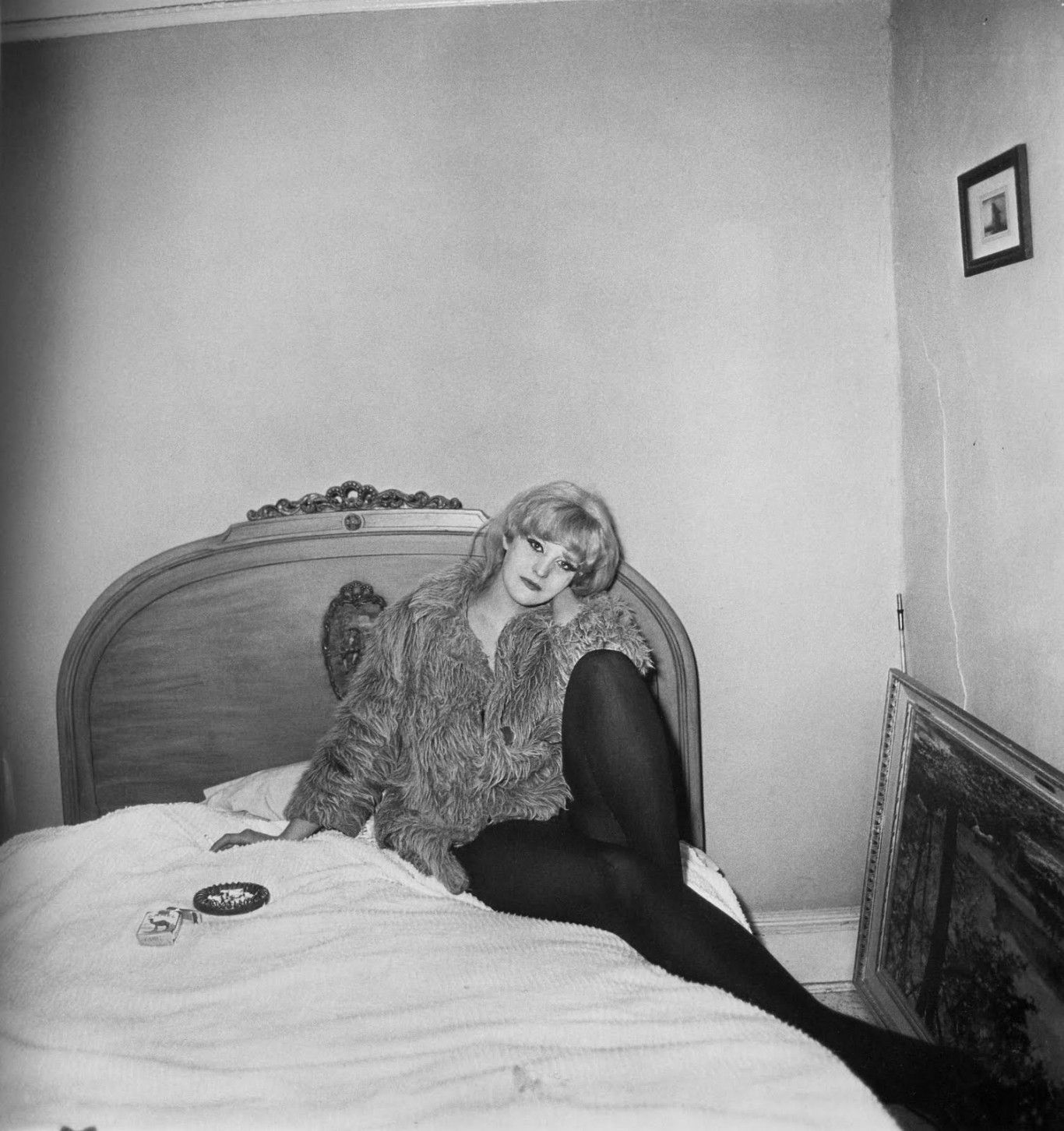 Diane arbus-girl-in-a-coat-lying-in-her-bed-nyc-1968