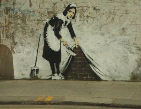Guerrilla-art-banksy-maid-sweep