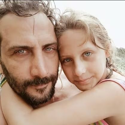 Luciano Cáceres y Amelia, su hija de 9 años. 
