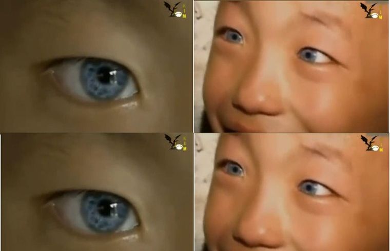 La imagen de los ojos del pequeño niño que mira en la oscuridad