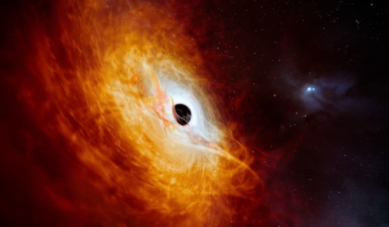 Reproducción artística que muestra el núcleo brillante de una galaxia distante alimentado por un agujero negro supermasivo. Foto: Efe.