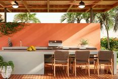 Modelo de isla de cocina al aire libre de baja altura (con el techo bajo) y con asientos. Foto: Caesarstone