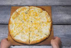 Pizza quattro formaggi : receta fácil y deliciosa Foto: Shutterstock