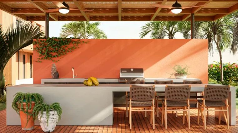 Modelo de isla de cocina al aire libre de baja altura (con el techo bajo) y con asientos. Foto: Caesarstone