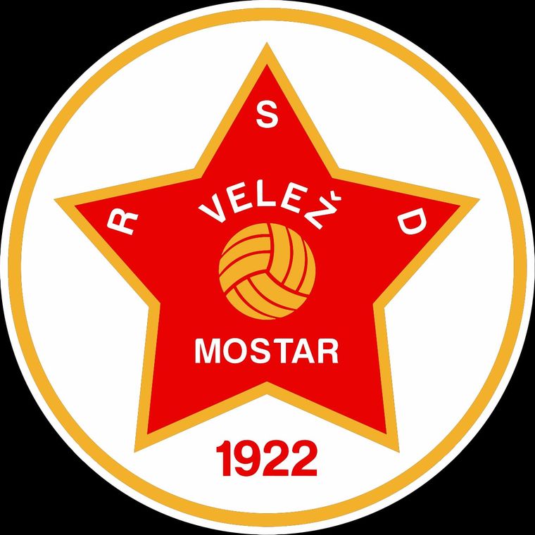 Escudo del Vele Mostar de Bosnia. Tiene la particularidad que posee una estrella roja, símbolo vivo de la vieja Yugoslavia. Escudo del Vele Mostar de Bosnia. Tiene la particularidad que posee una estrella roja, símbolo vivo de la vieja Yugoslavia.