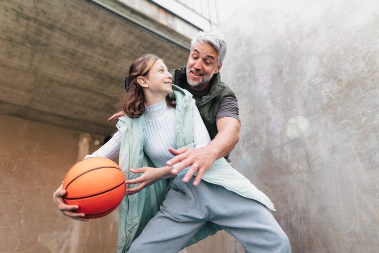 father-and-daughter-playing-basketball