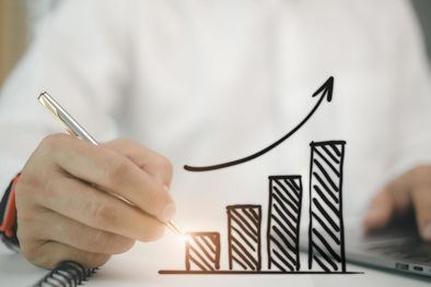 MDZol | businessman-draws-an-increasing-trend-arrow-and-a-rising-chart-from-plan-to-goal-it-is-a-representation-of-the-idea-of-corporate-investment-development-free-photo