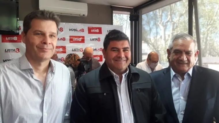 Arce, junto a dos de sus mentores políticos.