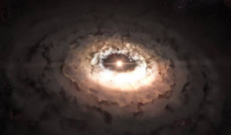 Polvo rodea una joven estrella. Foto: Dpa.