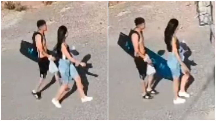 La pareja que fue captada por una cámara de seguridad tras el robo de la tabla de kitesurf. 