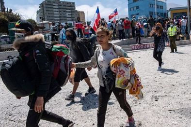 MDZol | Decenas de venezolanos tuvieron que escapar de la marcha antimigrante realizada el 26 de septiembre en la ciudad de Iquique (Chile). Foto: Getty Images