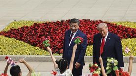 Donald Trump y Xi Jinping caminan juntos a la par. Donald Trump y Xi Jinping caminan juntos a la par.
