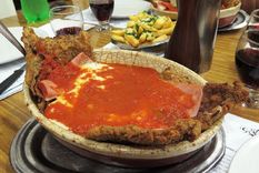 Milanesa a la napolitana, plato clásico de los bodegones. Foto: MDZ