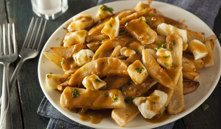 ¡Crujiente, fundente, iresistible! Receta de poutine canadiense para todos Foto: Shutterstock
