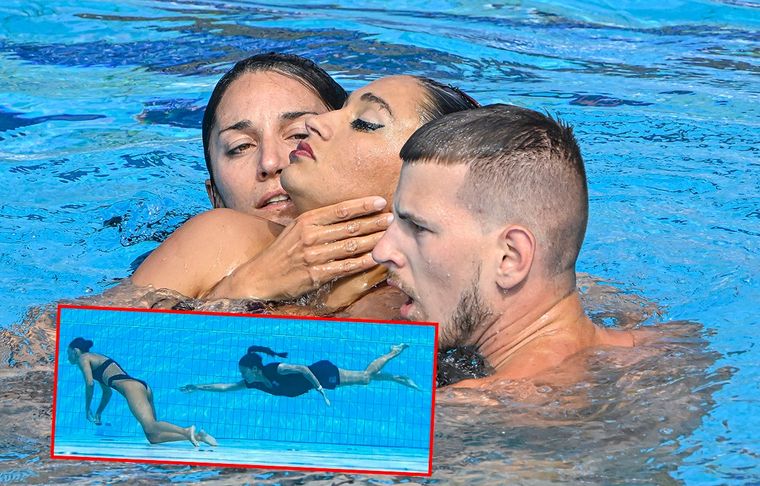Anita Álvarz, siendo ayudada a salir de la piscina por su entrenadora después de que se desmayara al final de su actuación durante la final libre femenina de natación artística del Mundial de Natación en Budapest. Foto: EFE/EPA/Zsolt Szigetvary y Twitter @cdelamor_