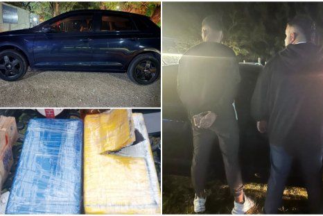 Los dos detenidos por estafa y los ladrillos de cocaína junto al vehículo en el que se movilizaban. Los dos detenidos por estafa y los ladrillos de cocaína junto al vehículo en el que se movilizaban.