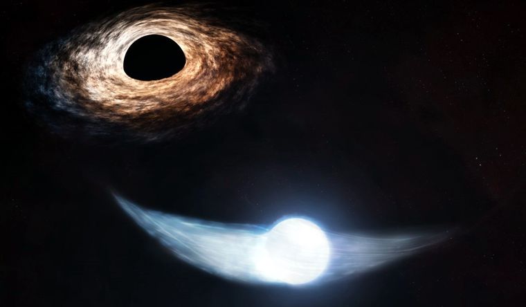 Representación artística de una estrella parcialmente desintegrada por la atracción de un agujero negro. Foto: Dpa.