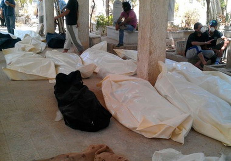 Bolsas con cadáveres. Foto: Reuters